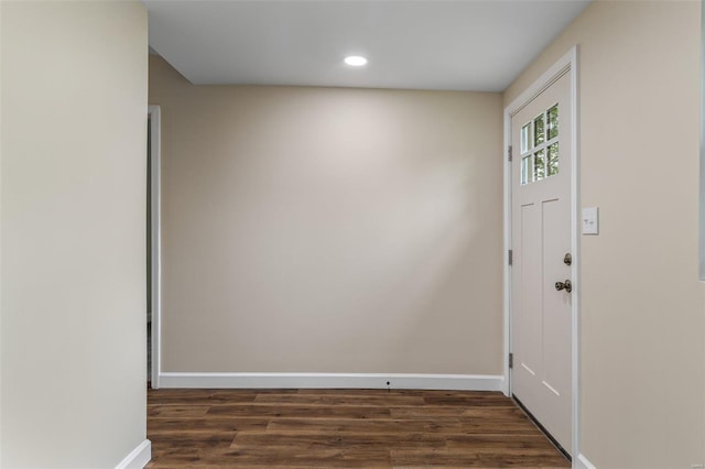 interior space with baseboards, dark wood-style floors, and recessed lighting