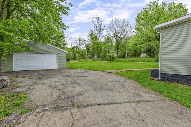 exterior space featuring an outdoor structure and a detached garage
