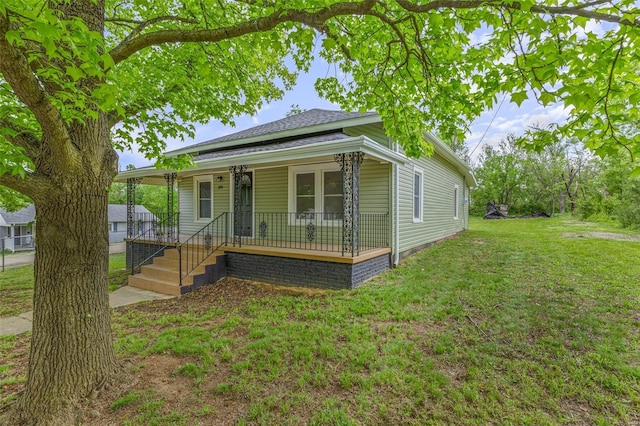 view of front of home featuring a front lawn and a porch