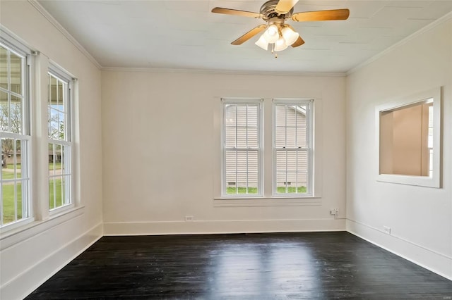 unfurnished room with a healthy amount of sunlight, baseboards, and crown molding
