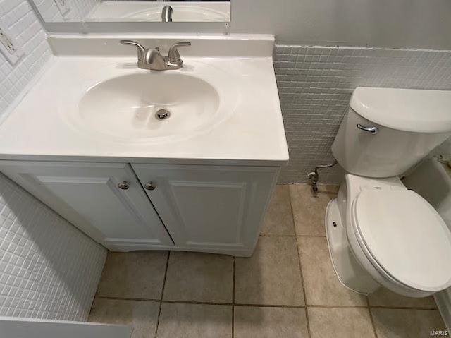 bathroom with vanity, tile patterned floors, and toilet