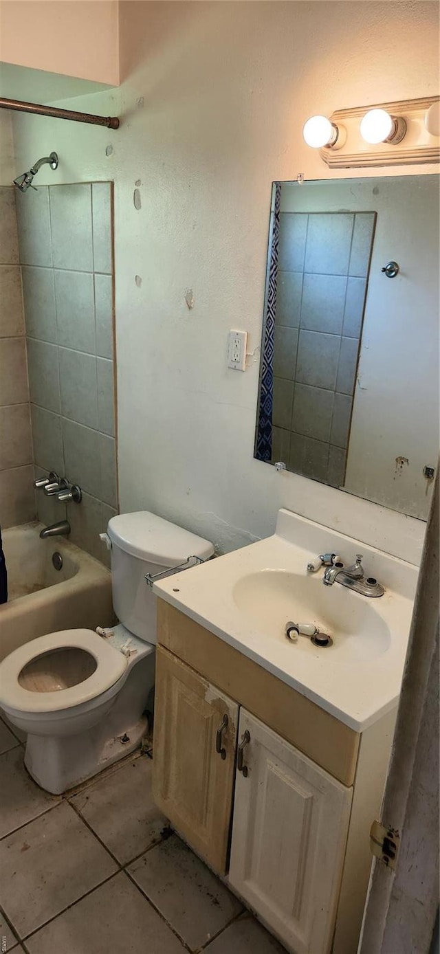 bathroom featuring vanity, tile patterned flooring, toilet, and bathing tub / shower combination