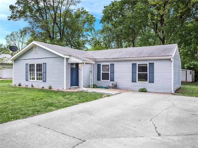 single story home with a front yard and a shingled roof