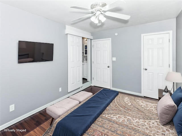 bedroom with wood finished floors, baseboards, and a ceiling fan
