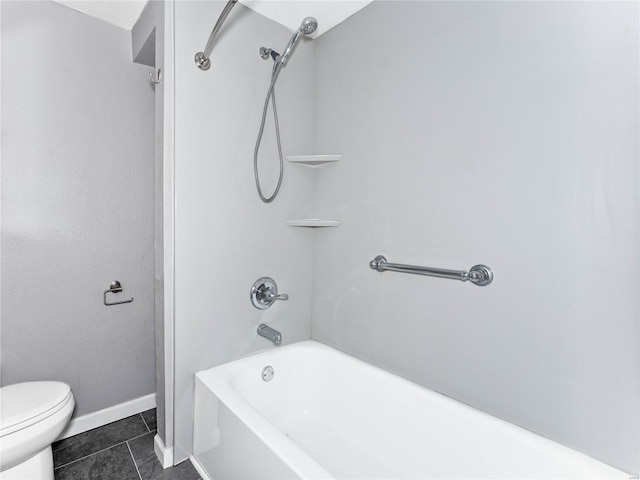 bathroom with toilet, bathtub / shower combination, tile patterned floors, and baseboards