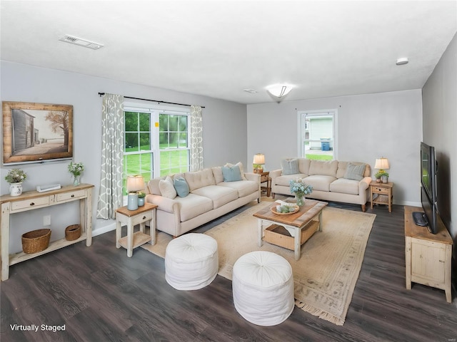 living room with wood finished floors and baseboards