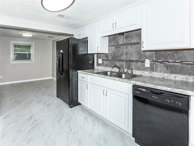 kitchen featuring black appliances, a sink, white cabinets, backsplash, and baseboards