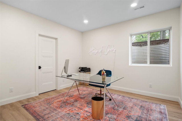office space with visible vents, light wood-style flooring, baseboards, and recessed lighting