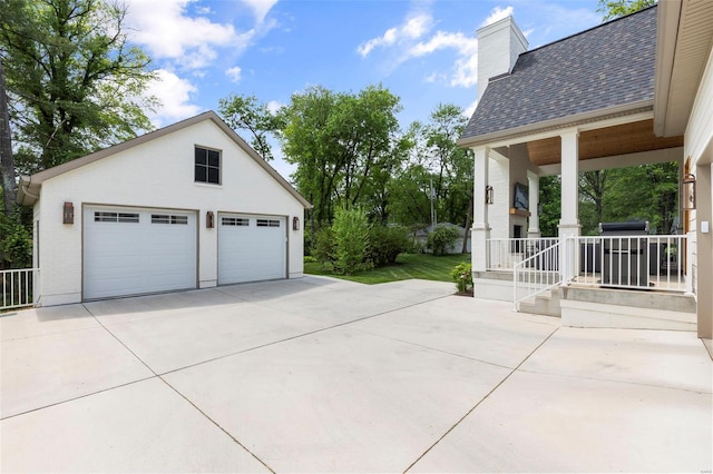 detached garage with covered porch