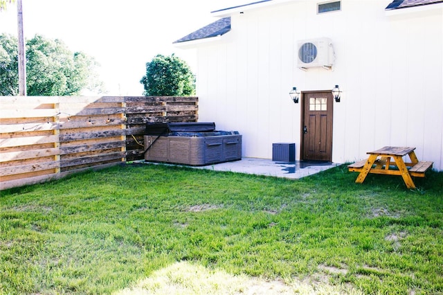 view of yard with ac unit and fence