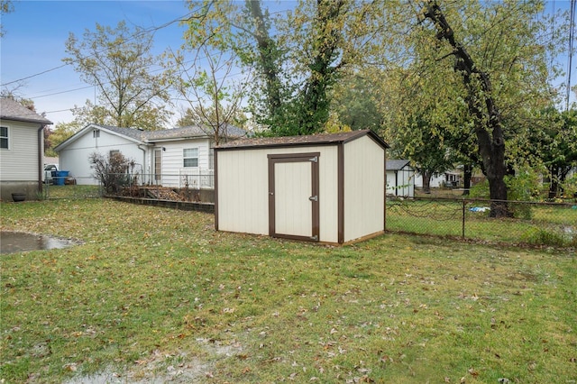 view of shed featuring a fenced backyard