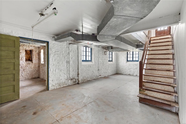 below grade area with a wealth of natural light and stairs