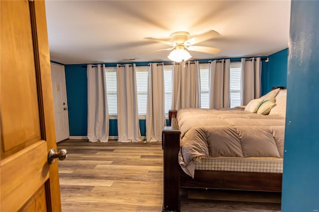 bedroom featuring light wood-style floors and ceiling fan