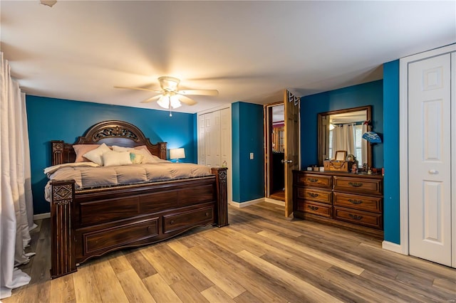bedroom with baseboards, light wood finished floors, and ceiling fan