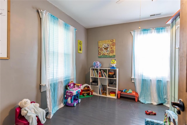 rec room with visible vents and wood finished floors
