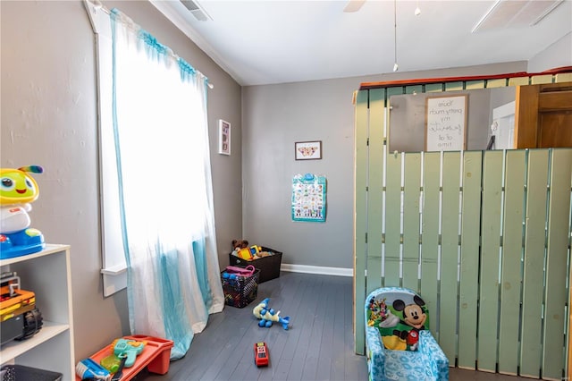 playroom with baseboards, hardwood / wood-style floors, and ceiling fan