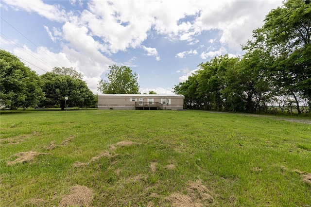 view of yard featuring a wooden deck