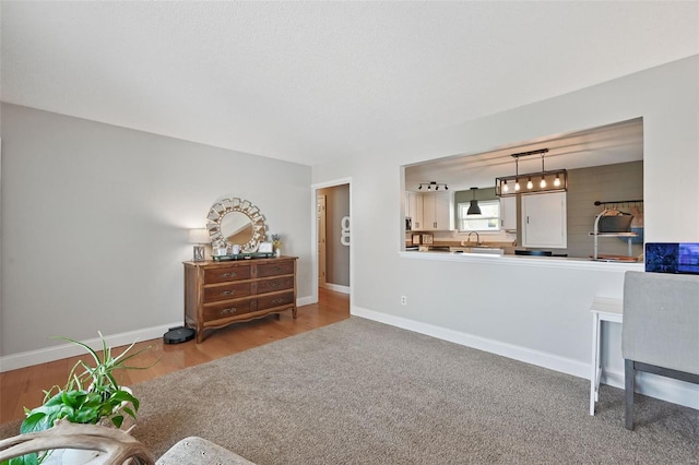 interior space featuring baseboards and wood finished floors