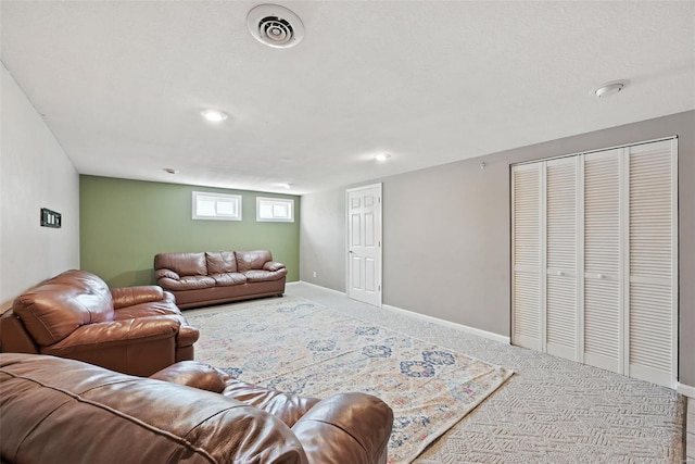living room with recessed lighting, visible vents, baseboards, and carpet floors