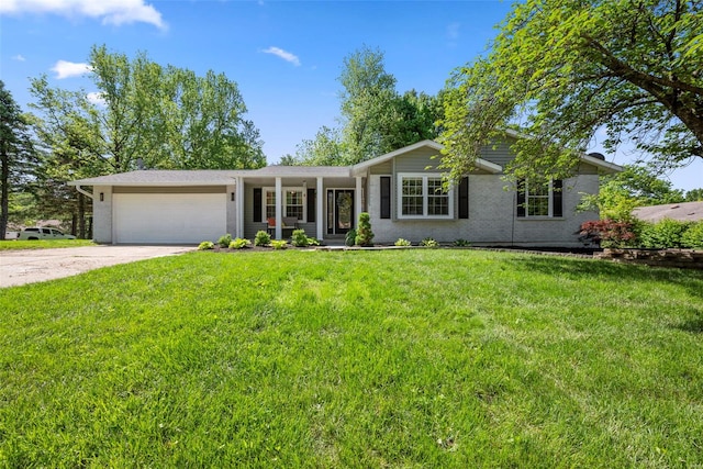 ranch-style house featuring a garage, driveway, a front yard, and brick siding