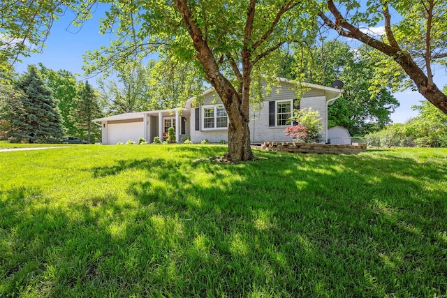 ranch-style home with a front lawn and an attached garage