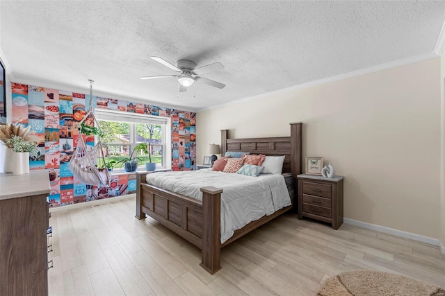 bedroom with a textured ceiling, light wood finished floors, ceiling fan, ornamental molding, and baseboards
