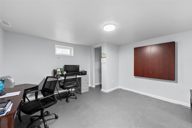office with finished concrete floors and baseboards