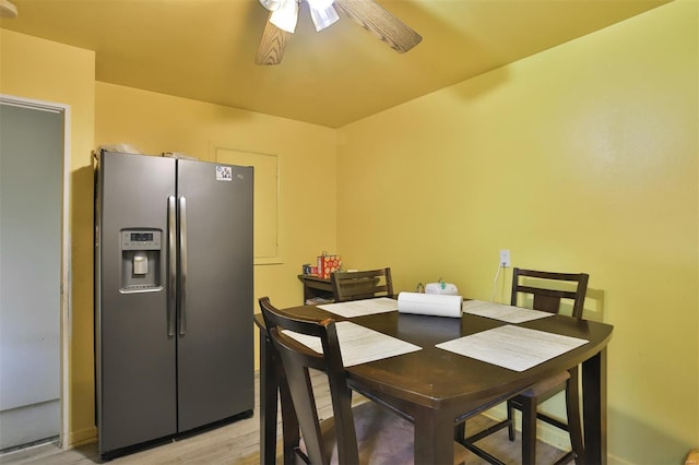 dining room featuring a ceiling fan and light wood-type flooring