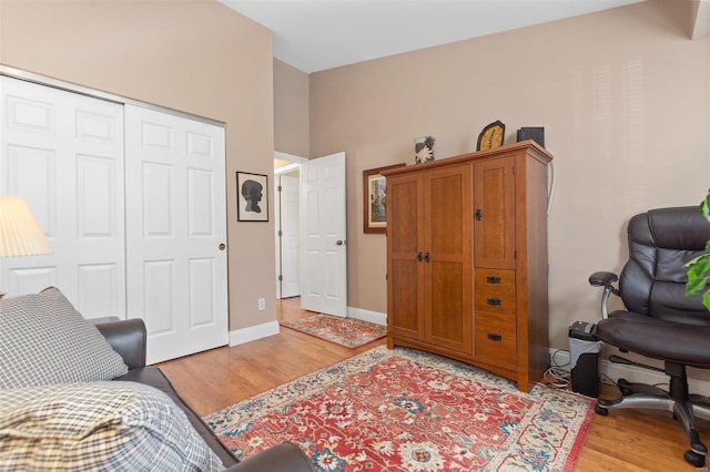 interior space featuring baseboards and light wood-type flooring