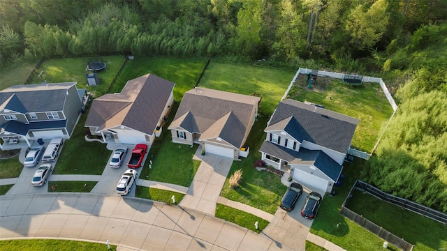 birds eye view of property with a wooded view and a residential view