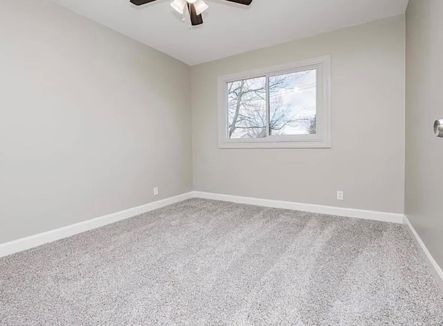 unfurnished room featuring a ceiling fan, baseboards, and carpet floors