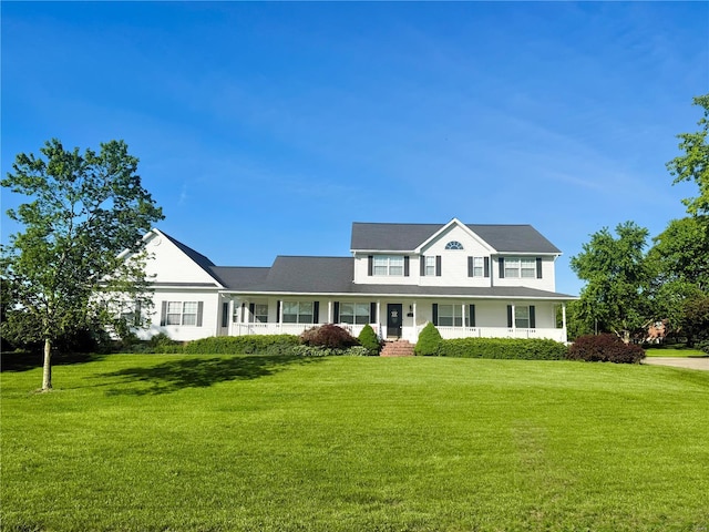view of front of home with covered porch and a front lawn