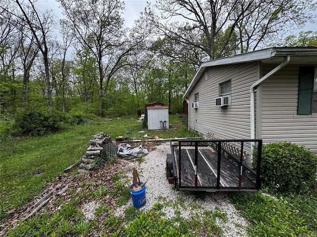 view of yard featuring an outbuilding and a storage unit
