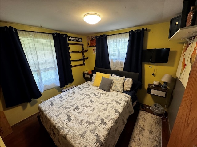 bedroom featuring baseboards