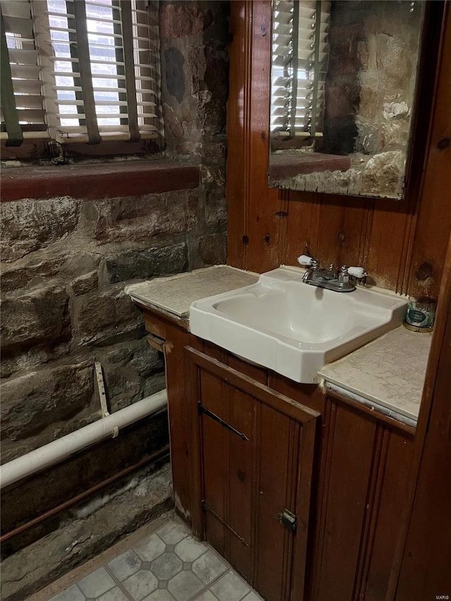 bathroom featuring tile patterned flooring and vanity