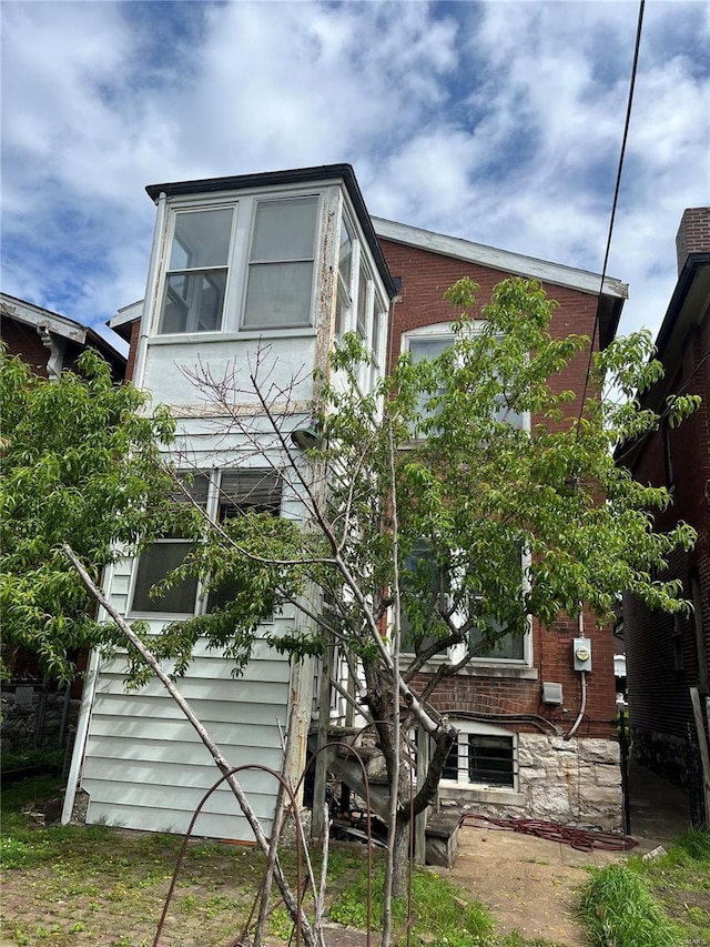 view of home's exterior featuring brick siding