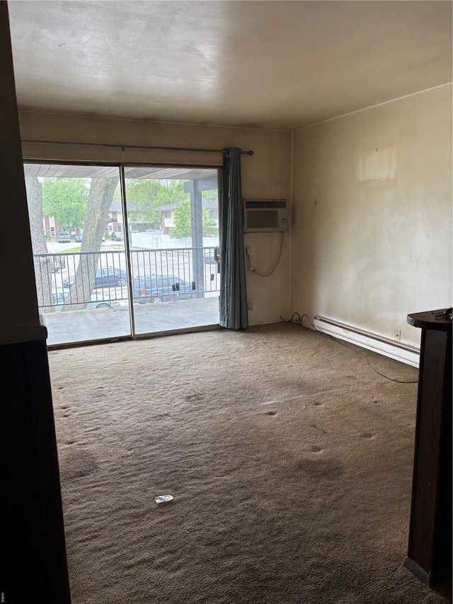 unfurnished living room with carpet, a wall mounted AC, and a baseboard heating unit