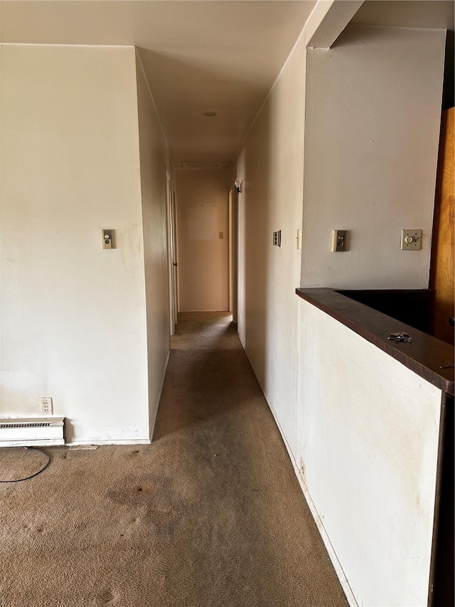 hall featuring carpet flooring and baseboard heating