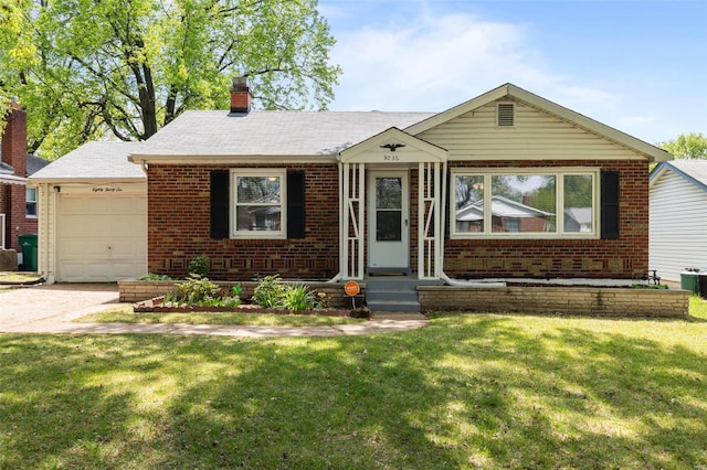 ranch-style house with a chimney, a front lawn, brick siding, and an attached garage