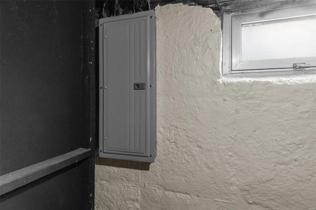 details with electric panel and stucco siding