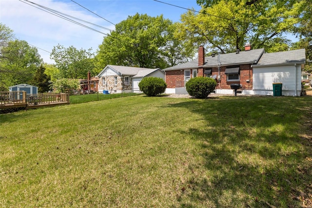 view of yard featuring a wooden deck