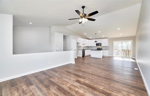 unfurnished living room with dark wood-style flooring, lofted ceiling, baseboards, and recessed lighting