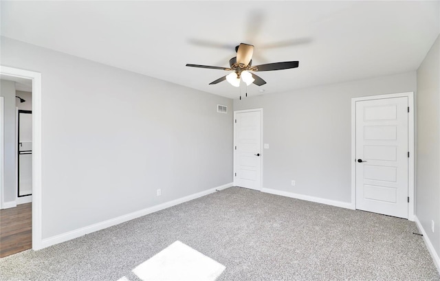 unfurnished bedroom featuring visible vents, baseboards, and carpet floors