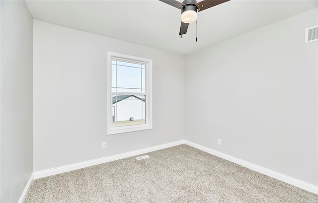 unfurnished room featuring carpet flooring, visible vents, baseboards, and a ceiling fan