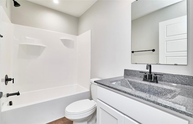 bathroom with toilet, vanity, shower / bathing tub combination, and wood finished floors