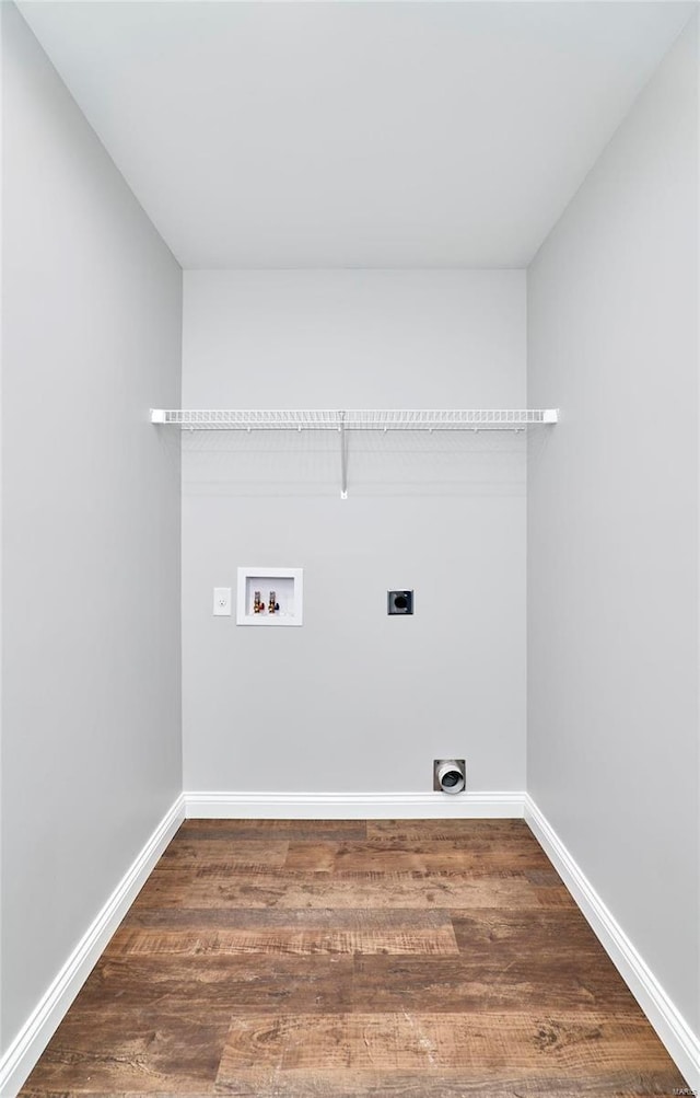 washroom with baseboards, hookup for a washing machine, wood finished floors, laundry area, and electric dryer hookup