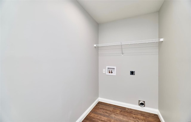 clothes washing area featuring electric dryer hookup, laundry area, hookup for a washing machine, dark wood-style flooring, and baseboards