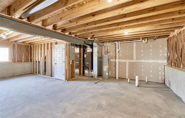 basement with water heater, electric panel, and heating unit