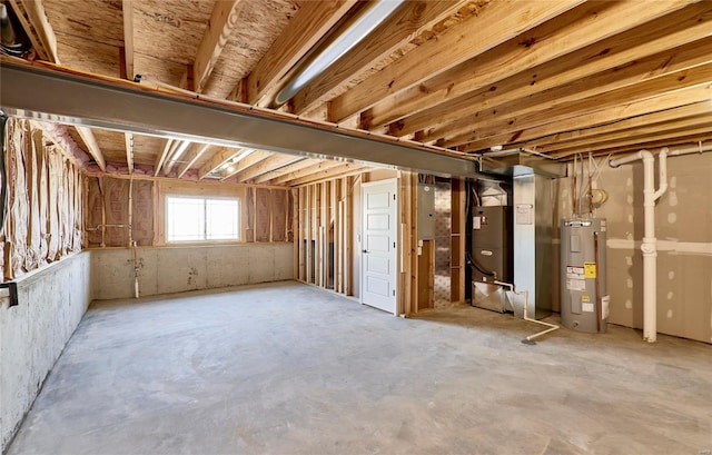 basement with electric water heater, electric panel, and heating unit