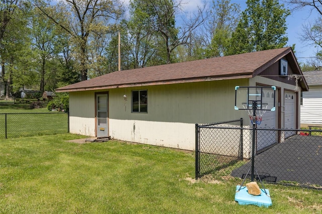 view of outbuilding featuring fence